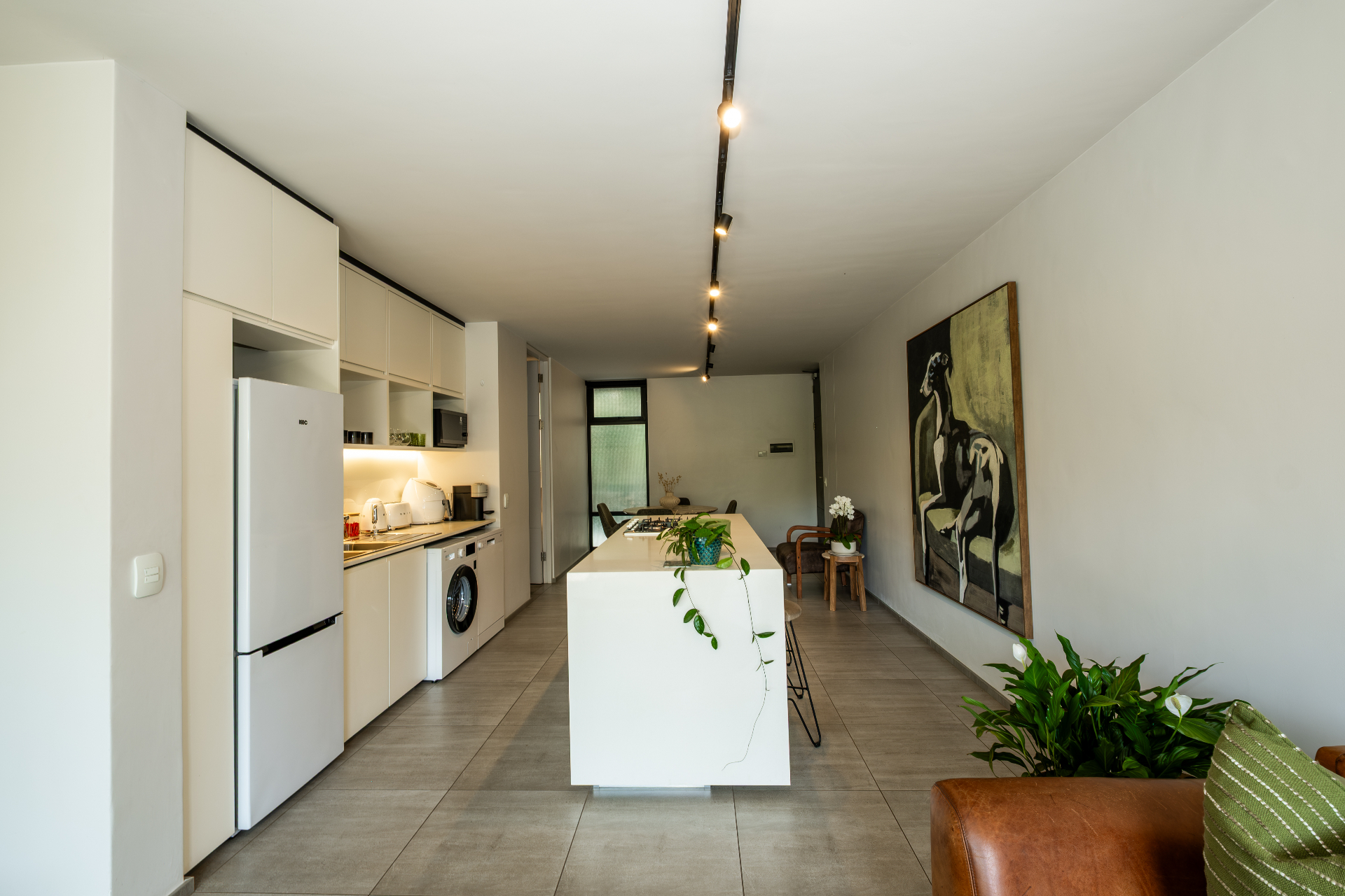 Wide open-plan kitchen and living area with island seating