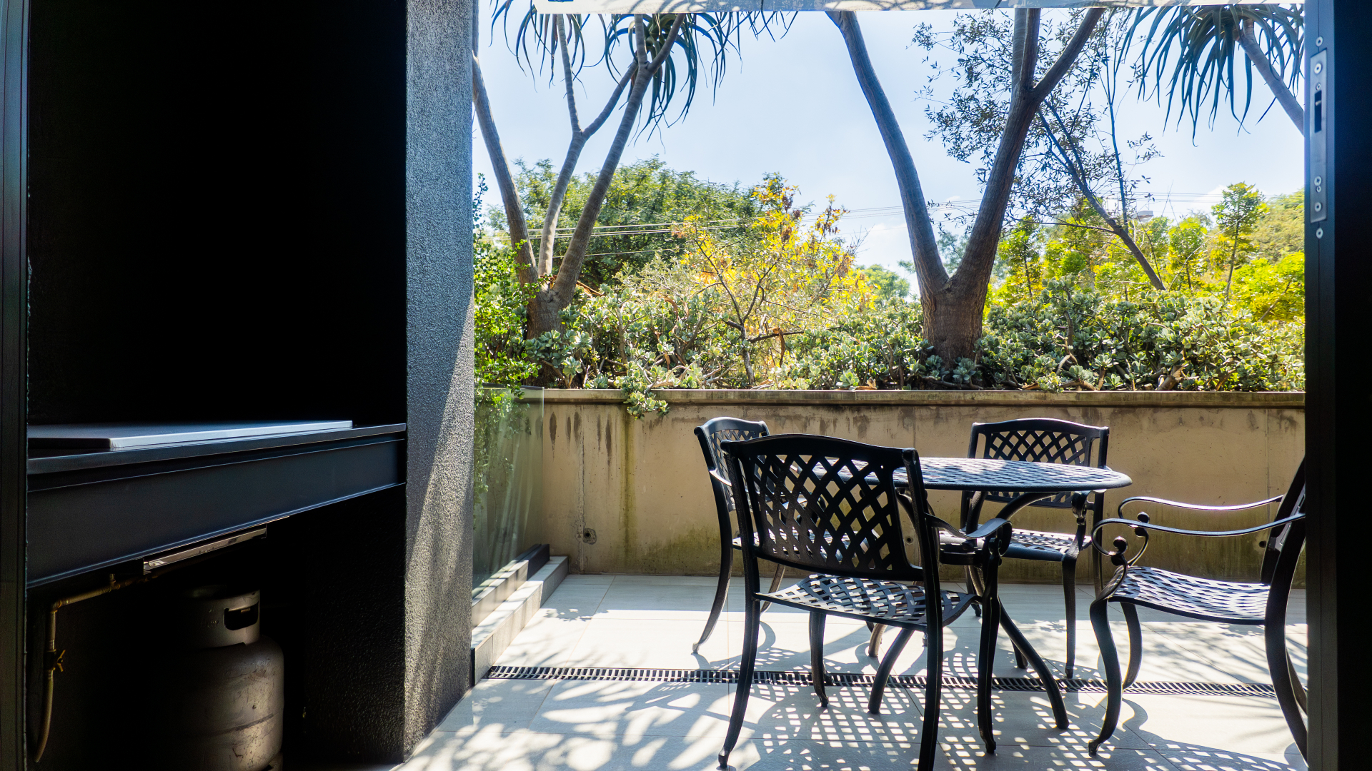 Covered patio dining nook beside the private braai